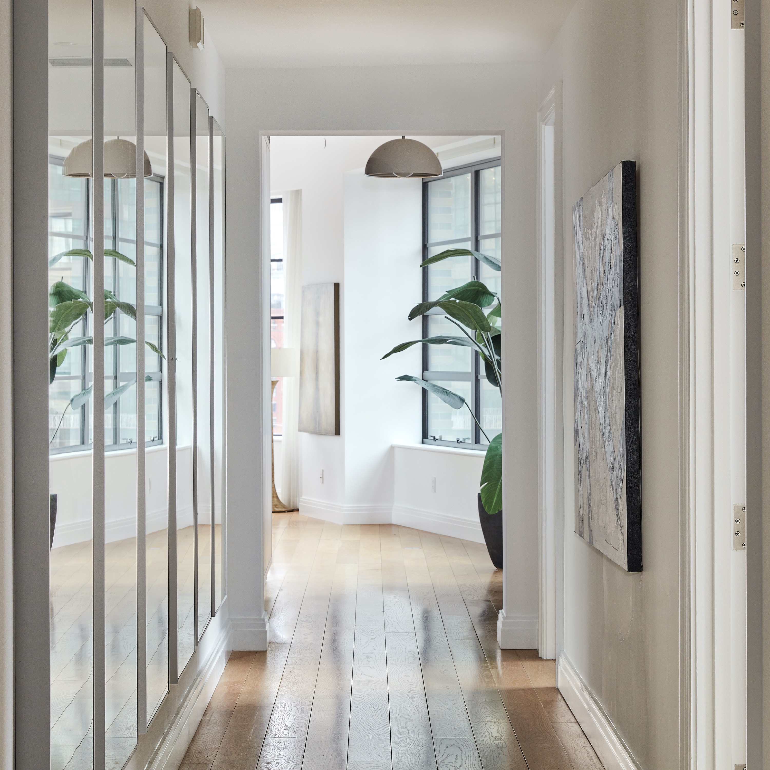 Mirrors along a hallway elongate the space.