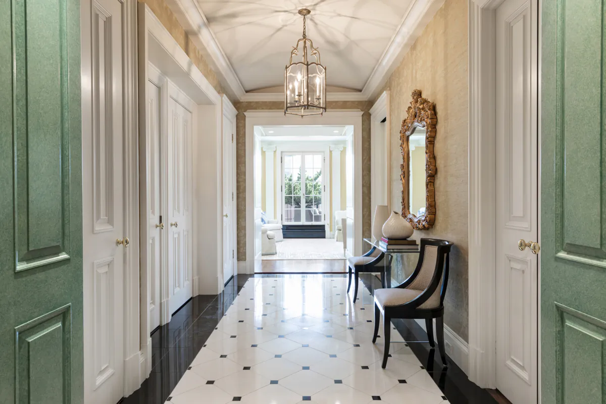 A formal entry hallway is made elegant through the use of a console, appropriately scaled chairs and an ornate mirror. (Handout/TNS)