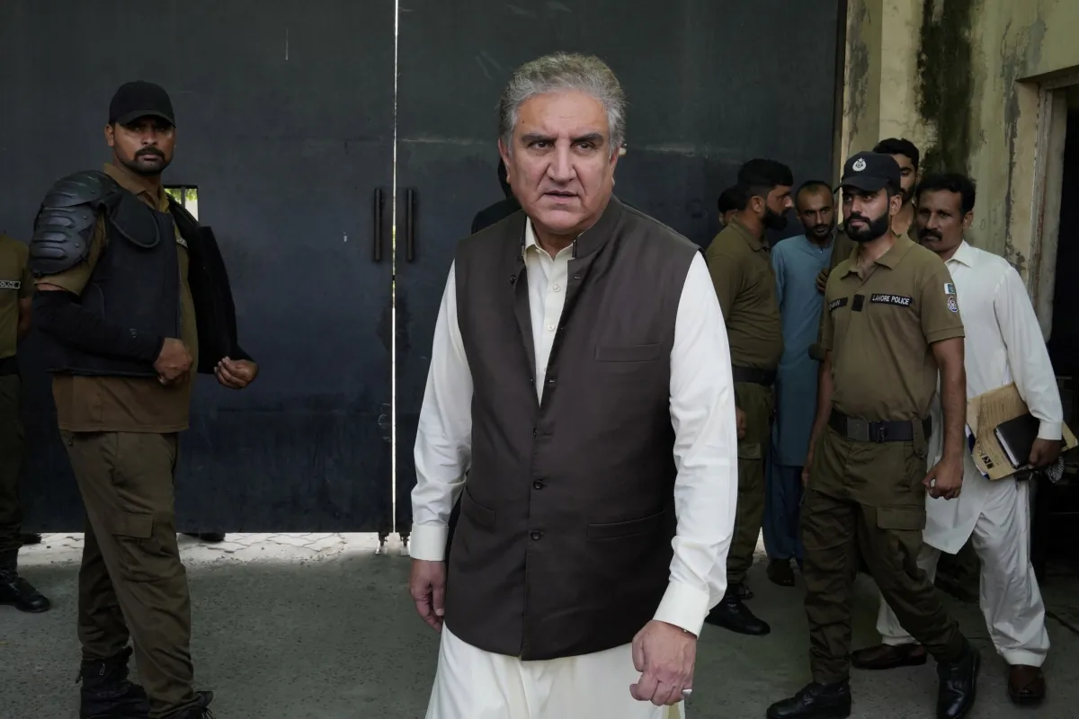 Shah Mahmood Qureshi (C), a top leader of Pakistan's former Prime Minister Imran Khan's "Pakistan Tehreek-e-Insaf" party, leaves after appearing in court in his case in Lahore, Pakistan, on Aug. 8, 2023. (K.M. Chaudary/AP Photo)