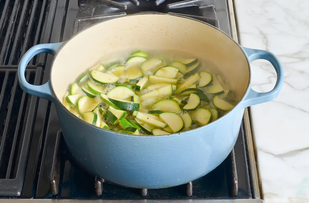 Making Creamy Zucchini Soup with Walnuts and Dill