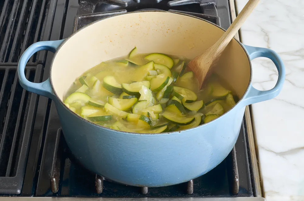 Making Creamy Zucchini Soup with Walnuts and Dill