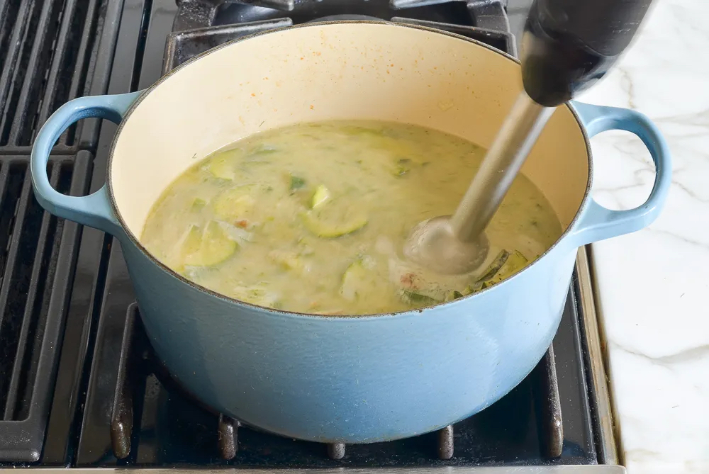 Making Creamy Zucchini Soup with Walnuts and Dill