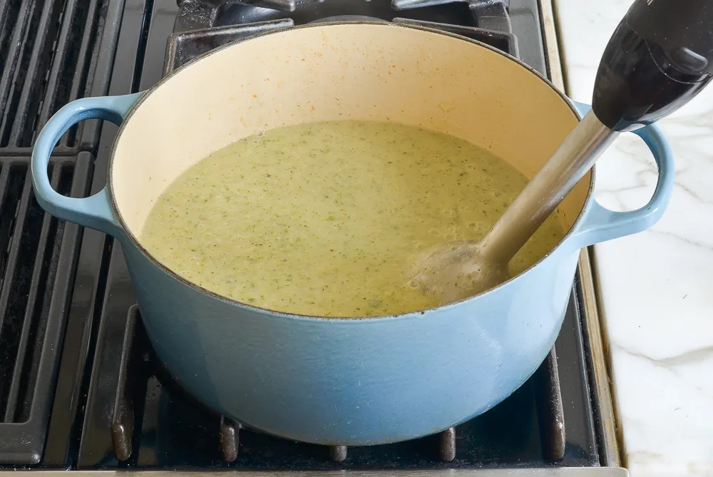 Making Creamy Zucchini Soup with Walnuts and Dill