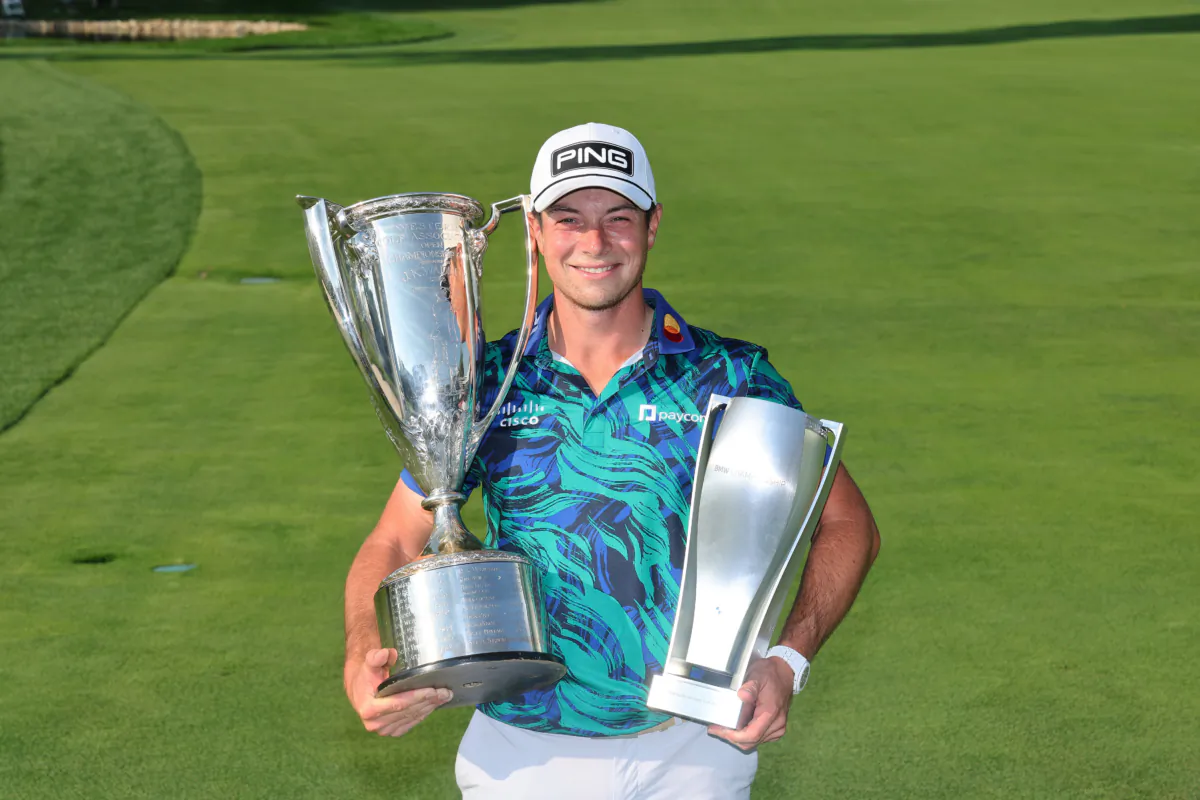 Viktor Hovland of Norway poses with the J.K. Wadley Trophy after winning the BMW Championship at Olympia Fields Country Club in Olympia Fields, Ill., on August 20, 2023. (Michael Reaves/Getty Images)