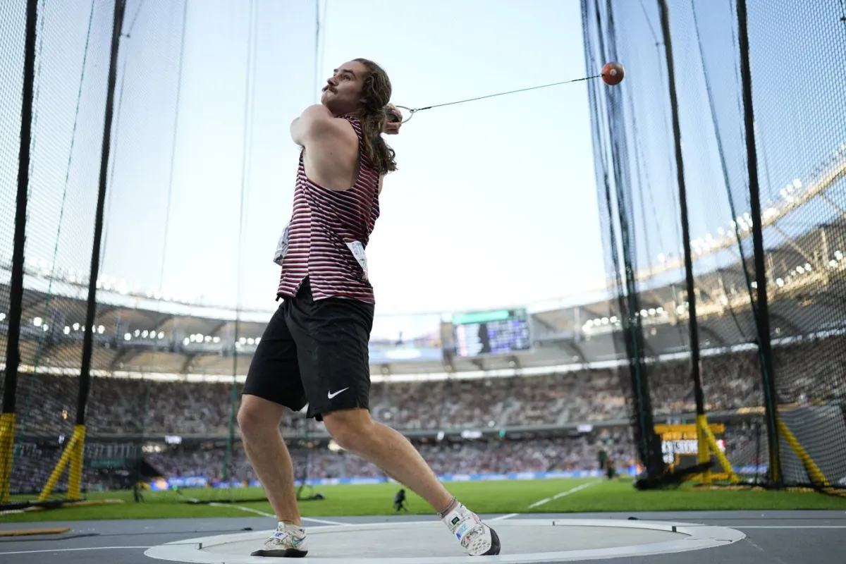 Ethan Katzberg, of Canada, makes an attempt in the Men's hammer throw final during the World Athletics Championships in Budapest, Hungary, Aug. 20, 2023. (The Canadian Press/AP-Bernat Armangue)
