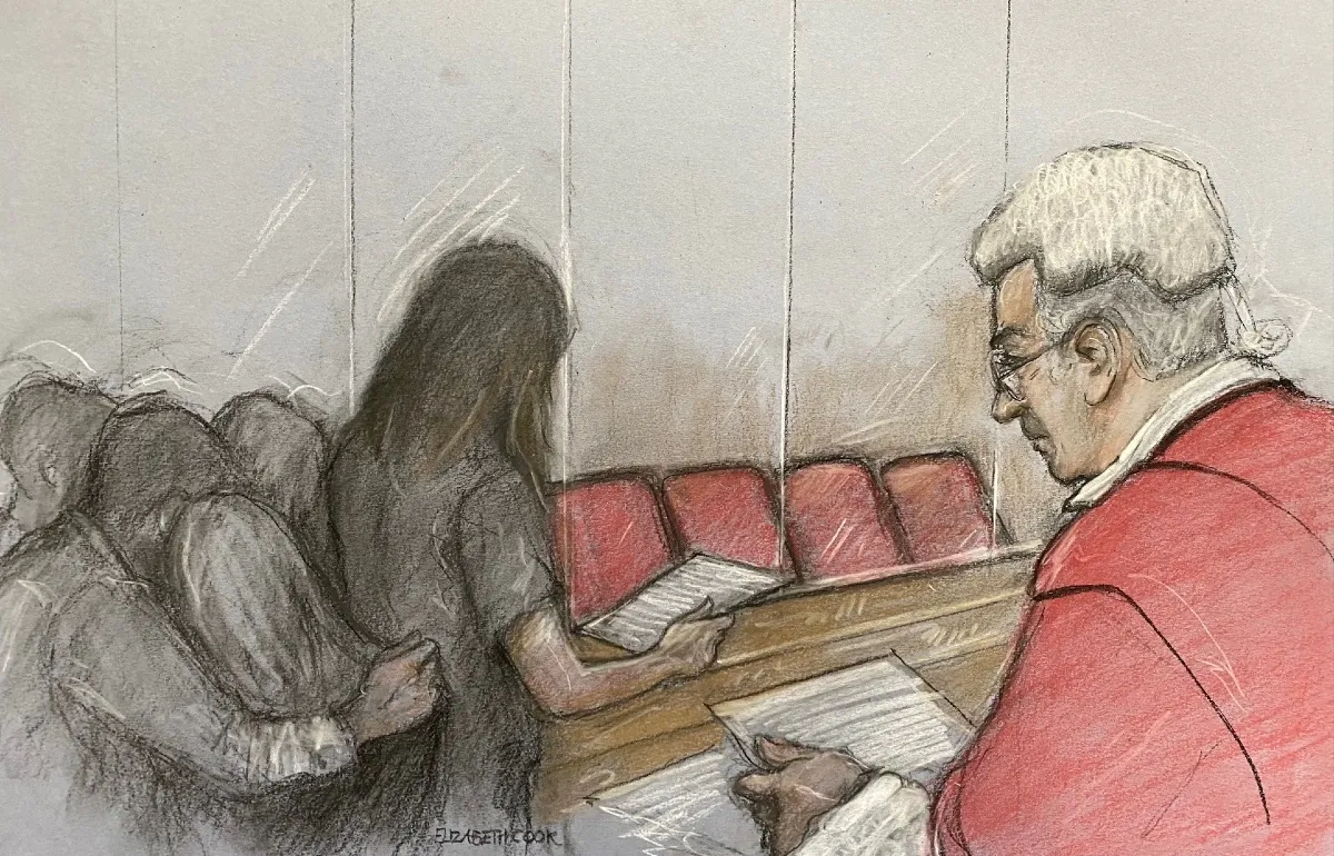 Court artist drawing by Elizabeth Cook on Aug. 21, 2023 of the parent of one of Lucy Letby's victims reading a victim impact statement at Manchester Crown Court as the serial child murderer refused to appear in court for sentencing. (PA Media)