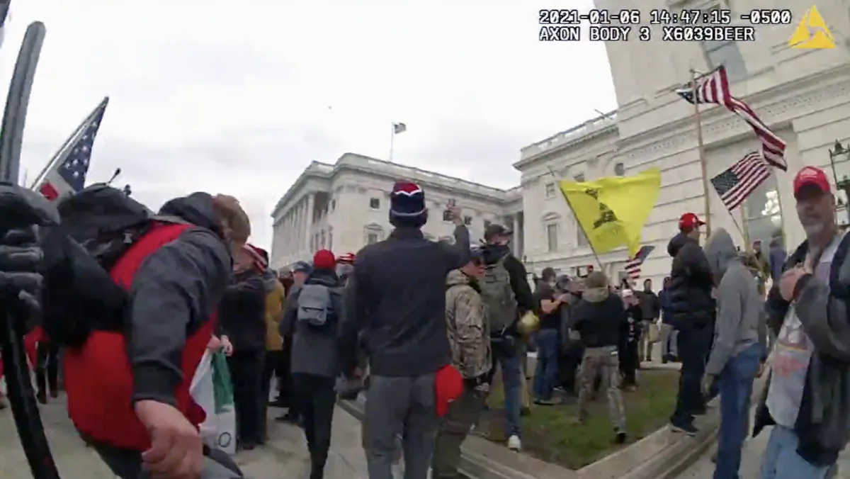 Metropolitan Police Department bodycam video shows protesters streaming into the U.S. Capitol after MPD officers were ordered to retreat from the entrance. (Metropolitan Police Department via U.S. District Court)