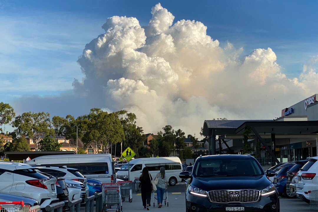 This picture shows smoke filling the sky as Sydney is enveloped in a thick bank of hazardous bushfire smoke forcing authorities in Australia's largest city to scale back controlled forest burning nearby. (Saeed Khan/Getty Images)
