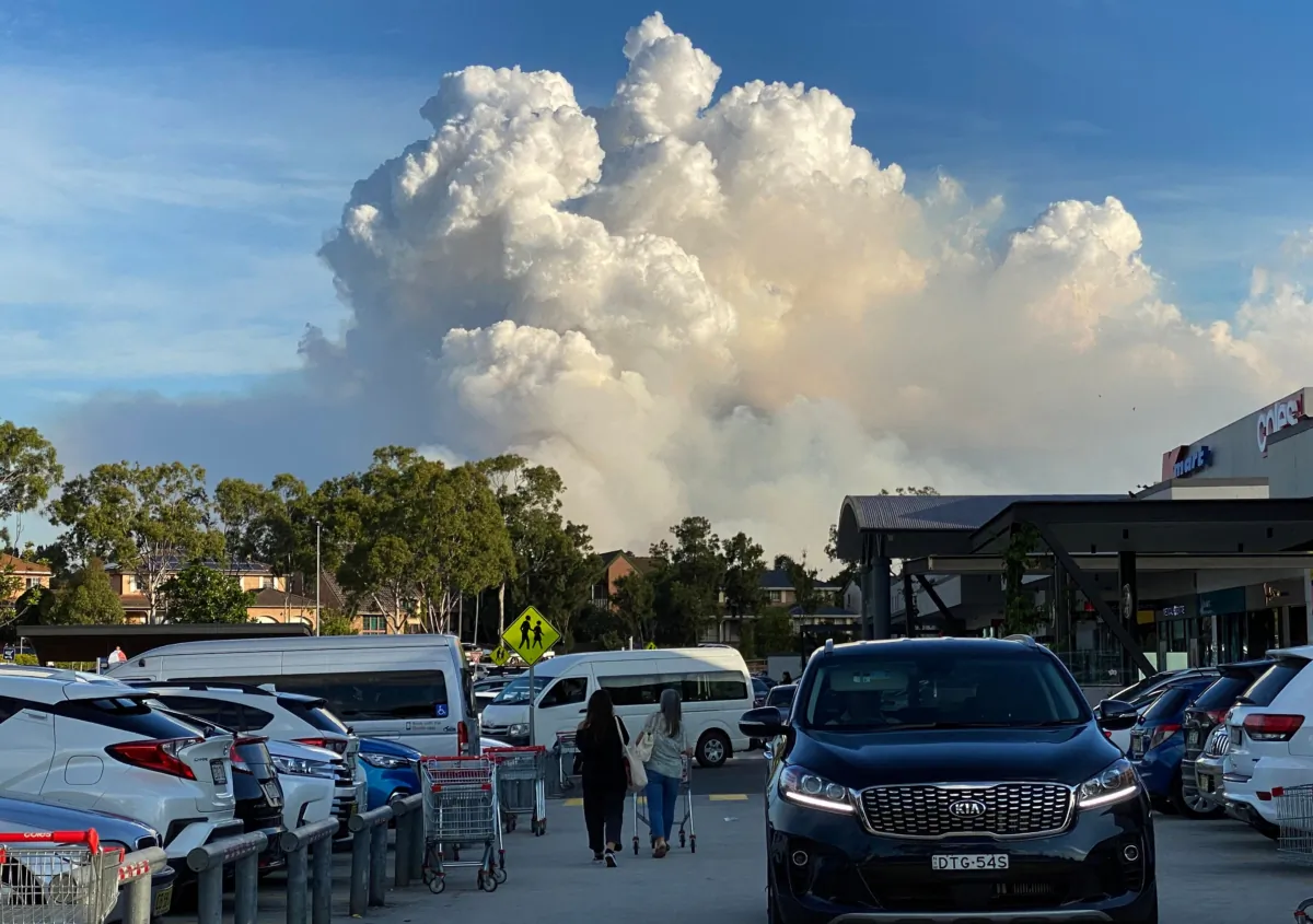 This picture shows smoke filling the sky as Sydney is enveloped in a thick bank of hazardous bushfire smoke forcing authorities in Australia's largest city to scale back controlled forest burning nearby. (Saeed Khan/Getty Images)