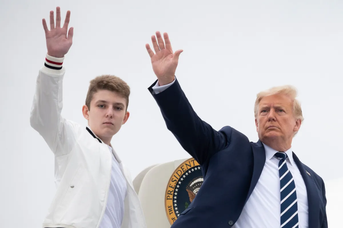 President Donald Trump (R) and his son Barron wave as they board Air Force One at Morristown Municipal Airport in Morristown, N.J., on Aug. 16, 2020. (Jim Watson/AFP via Getty Images)