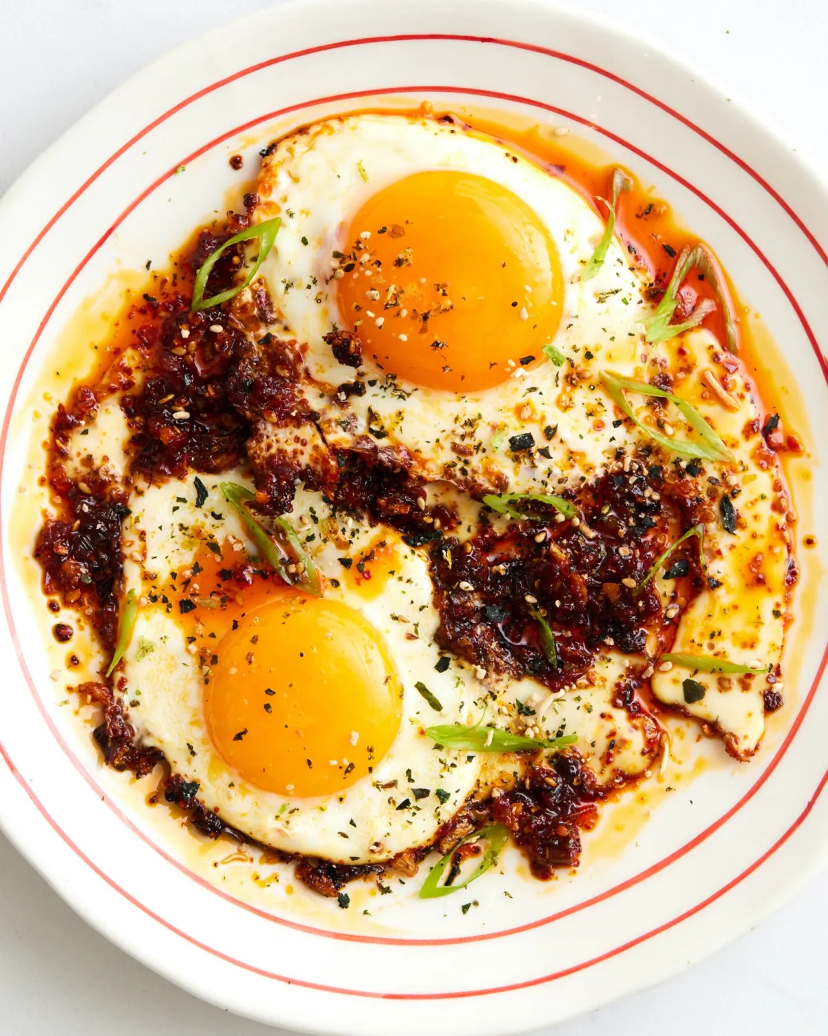 Our favorite way to level up a fried egg is cooking it in spicy, aromatic flavors. (Lucy Schaeffer/TNS)