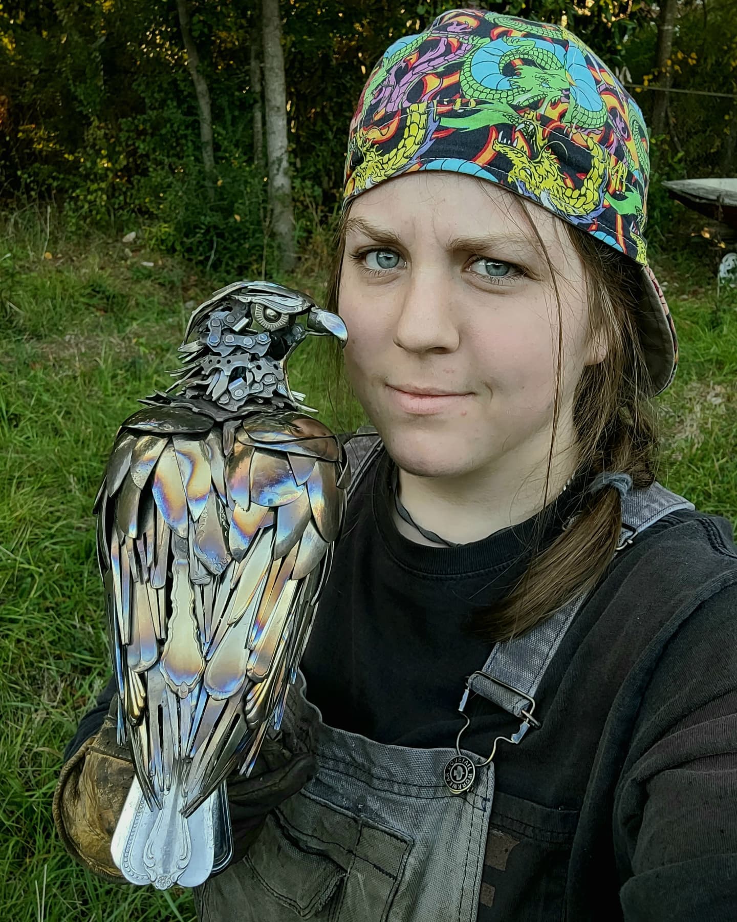 Leah Jeffrey with a metal piece that she sculpted.