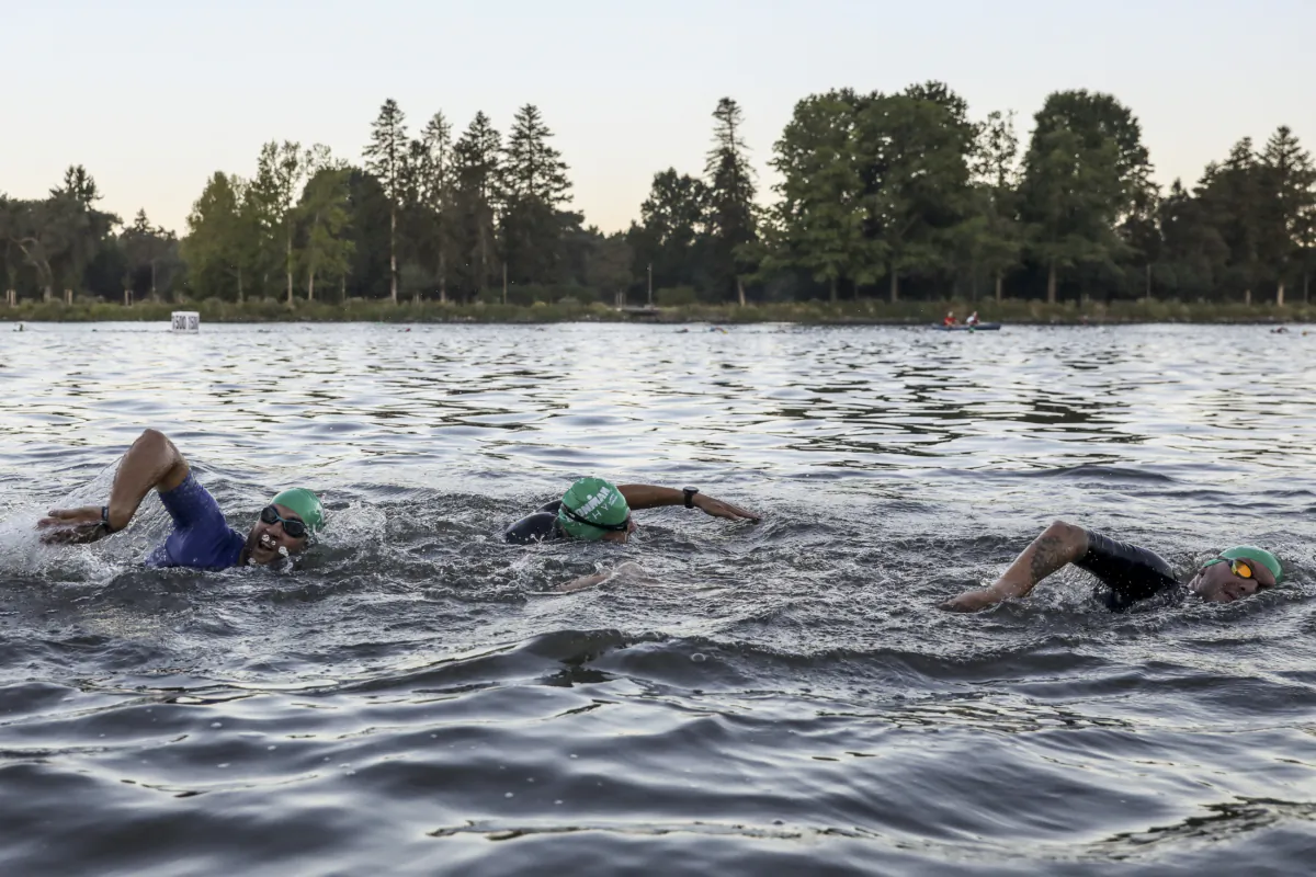 Athletes compete during the swim leg of IRONMAN Vichy in Vichy, France, on Aug. 20, 2023. (Pablo Blazquez Dominguez/Getty Images for IRONMAN)