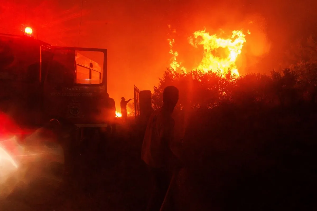 Firefighters try to extinguish the flames in a forest in Avantas village, near Alexandroupolis town, in the northeastern Evros region, Greece, on Aug. 21, 2023. (Achilleas Chiras/AP Photo)