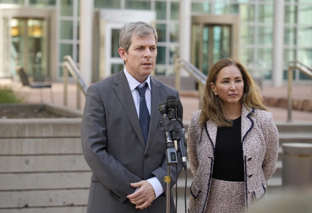 David Oscar Markus (L) and his co-counsel Margot Moss speak after a judge handed down a sentence of life in prison and more than $15 million in penalties to their client, Larry Rudolph, the wealthy owner of a Pittsburgh-area dental franchise, for killing his wife at the end of an African safari in Zambia, during a sentencing hearing in the federal courthouse in Denver on Aug. 21, 2023. (David Zalubowski/AP Photo)