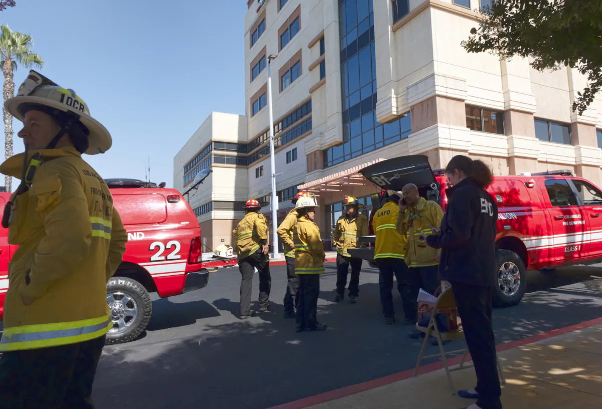Los Angeles Fire Department personnel gather at the Adventist Health White Memorial Medical Center in L.A., Calif., on Aug. 22, 2023. (Richard Vogel/AP Photo)