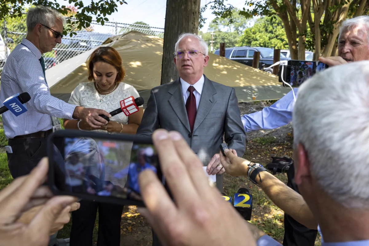 John Eastman (C), an attorney indicted with former President Donald Trump, makes a statement to media outside the Fulton County Jail in Atlanta, where he was booked on Aug. 22, 2023. (Arvin Temkar/Atlanta Journal-Constitution via AP)