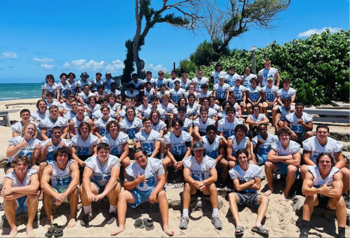 Villa Park High School football team poses for group photos during its season-opening trip in Oahu, Hawaii, on Aug. 11, 2023. (Courtesy of Dusan Ancich via Instagram/Screenshot via The Epoch Times)