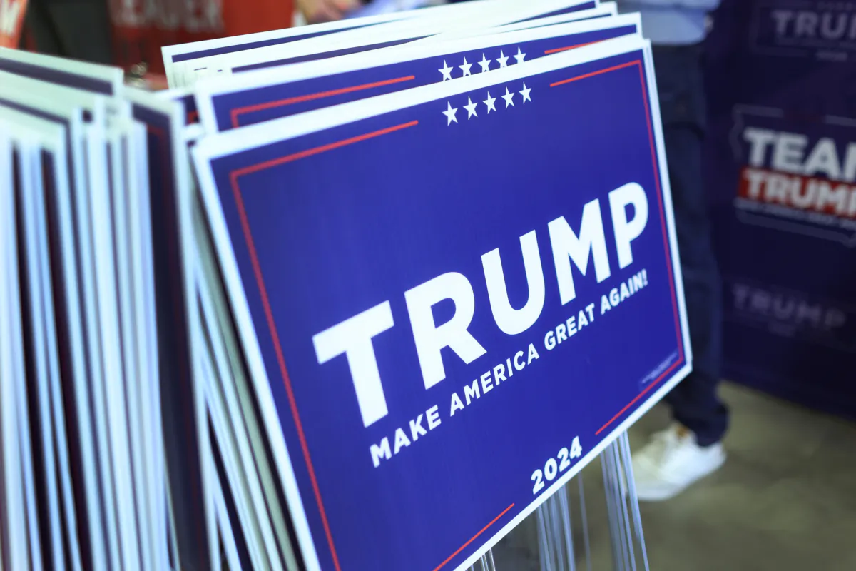 Yard signs showing support for Republican presidential candidate former President Donald Trump are passed out in Cedar Rapids, Iowa, on Aug. 6, 2023. (Scott Olson/Getty Images)