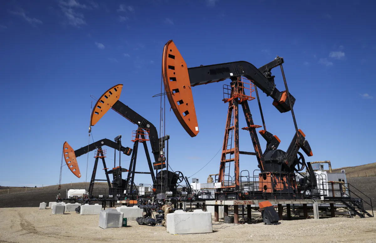 Pumpjacks draw out oil and gas from well heads near Calgary, Alta., on April 28, 2023. (The Canadian Press/Jeff McIntosh)