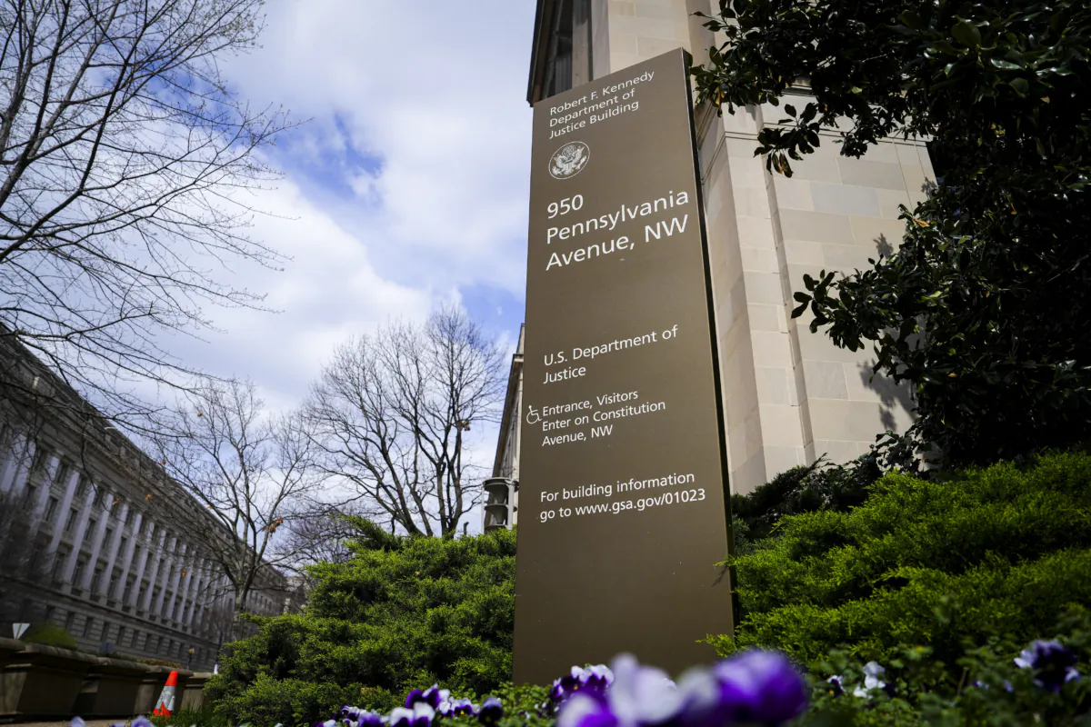 A sign of the U.S. Department of Justice in Washington on March 28, 2023. (Madalina Vasiliu/The Epoch Times)