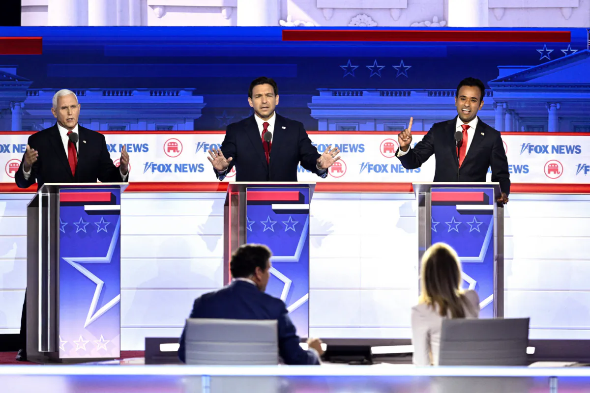 TOPSHOT - (From L) Former US Vice President Mike Pence, Florida Governor Ron DeSantis and entrepreneur and author Vivek Ramaswamy gesture during the first Republican Presidential primary debate at the Fiserv Forum in Milwaukee, Wisconsin, on August 23, 2023. (Photo by Brendan SMIALOWSKI / AFP) (Photo by BRENDAN SMIALOWSKI/AFP via Getty Images)