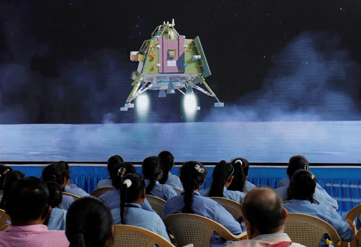 People watch a live stream of Chandrayaan-3 spacecraft's landing on the moon, inside an auditorium of Gujarat Science City in Ahmedabad, India, on Aug. 23, 2023. (Amit Dave/Reuters)
