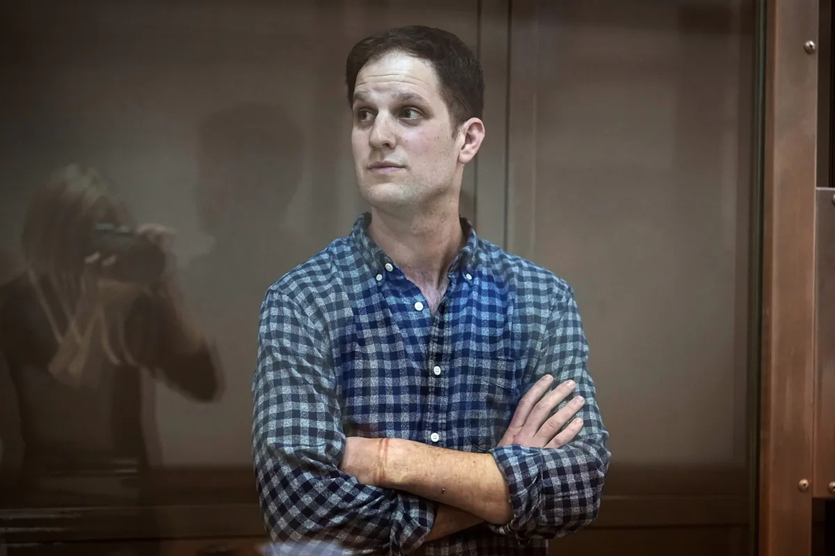 Wall Street Journal reporter Evan Gershkovich stands in a glass cage in a courtroom at the Moscow City Court in Moscow on April 18, 2023. (Alexander Zemlianichenko/AP Photo)