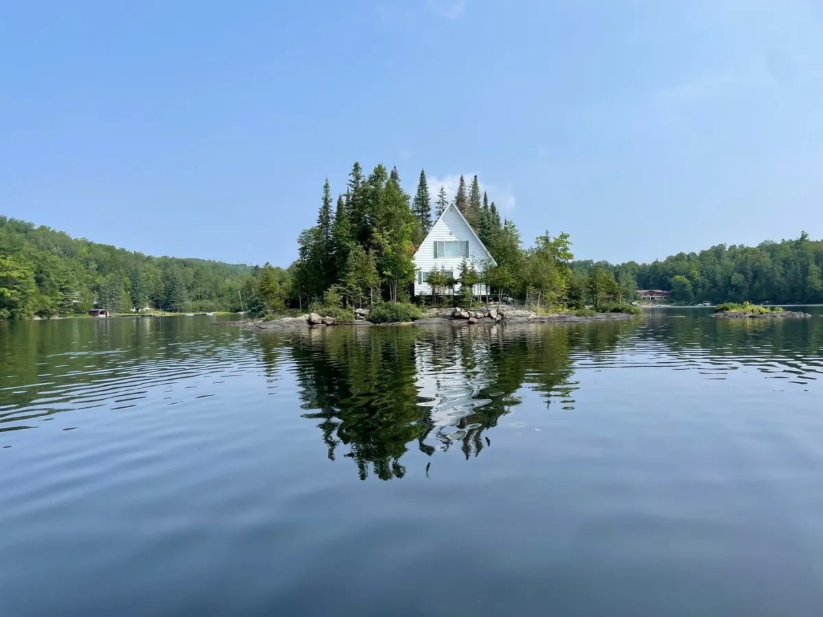 The Labelle, Que., getaway includes a single, two-bedroom cabin with enough room for eight people, as well as a barbecue, pedal boat, dinghy and other water sport equipment. (The Canadian Press/HO-Mon Technicien)
