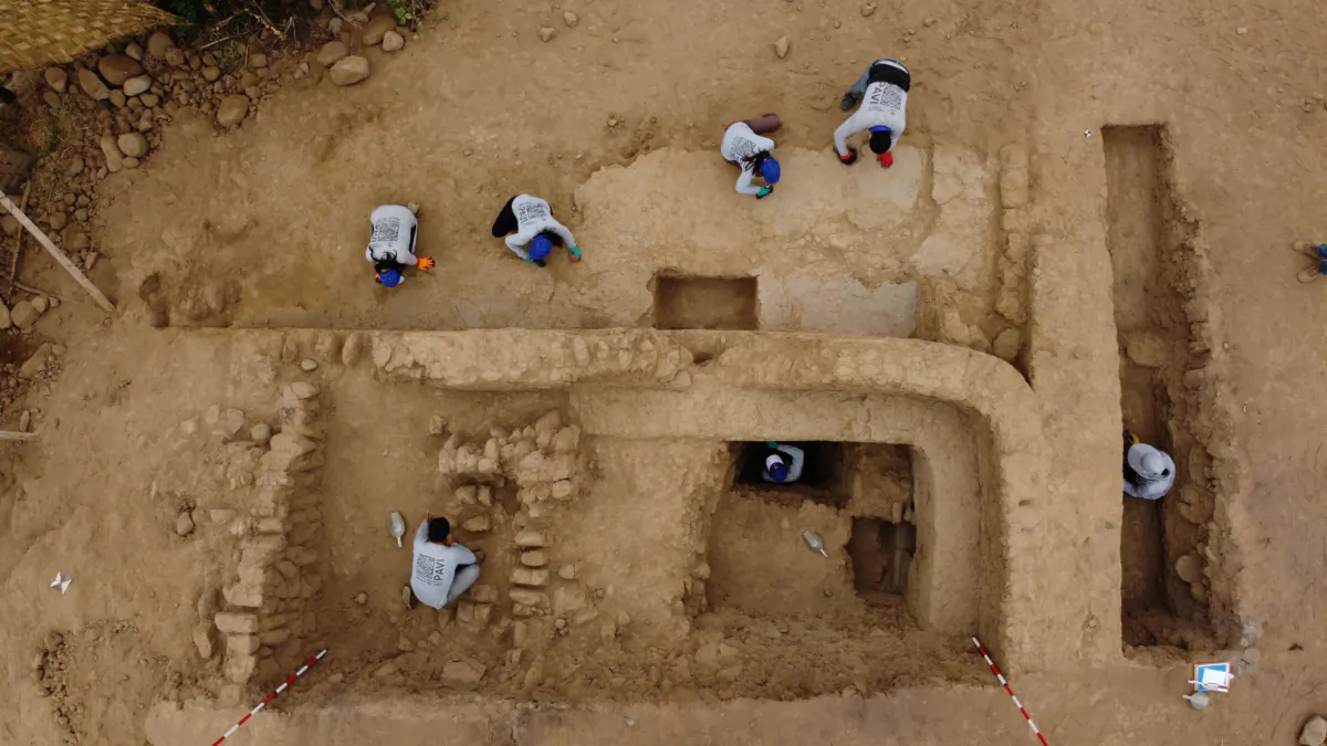 Archaeologists work on a 4,500-year-old polychrome wall, part of a temple belonging to the Late Preceramic period, in the Huaca Tomabal in the Valley of Viru, Peru, on Aug. 22, 2023. (Feren Castillo/PAVI/Handout via Reuters)