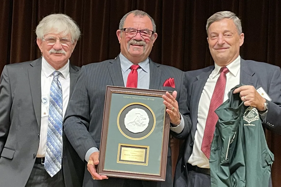 Mark Calentino (C) is awarded at the National Wrestling Hall of Fame lifetime service to wrestling award ceremony at the Laguna Hills Community Center in Laguna Hills, Calif., on Aug. 20, 2023. (Courtesy of John Hamro)