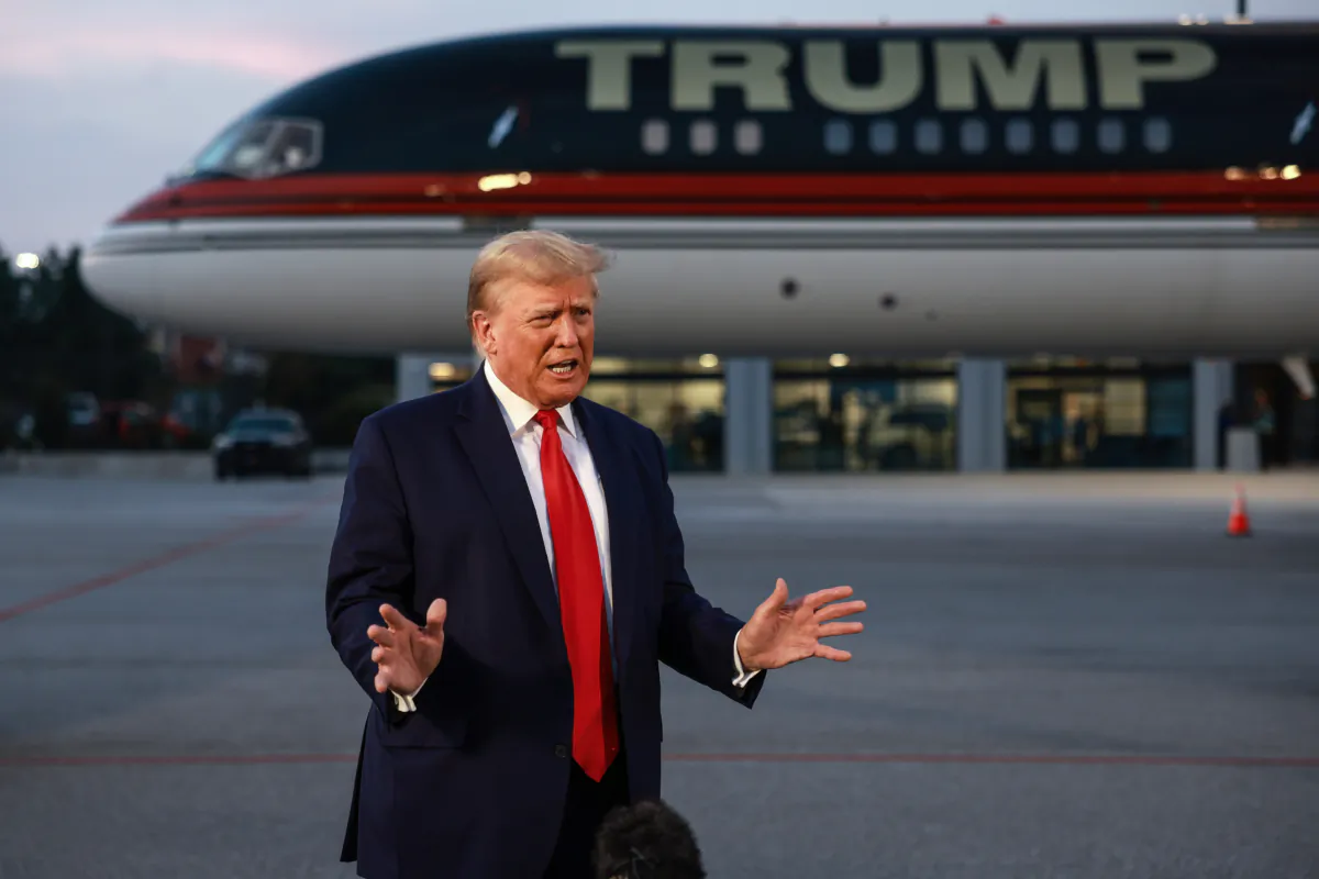 Former President Donald Trump speaks to reporters after being booked at the Fulton County jail on 13 charges related to the 2020 election, in Atlanta, Ga., on Aug. 24, 2023. (Joe Raedle/Getty Images)