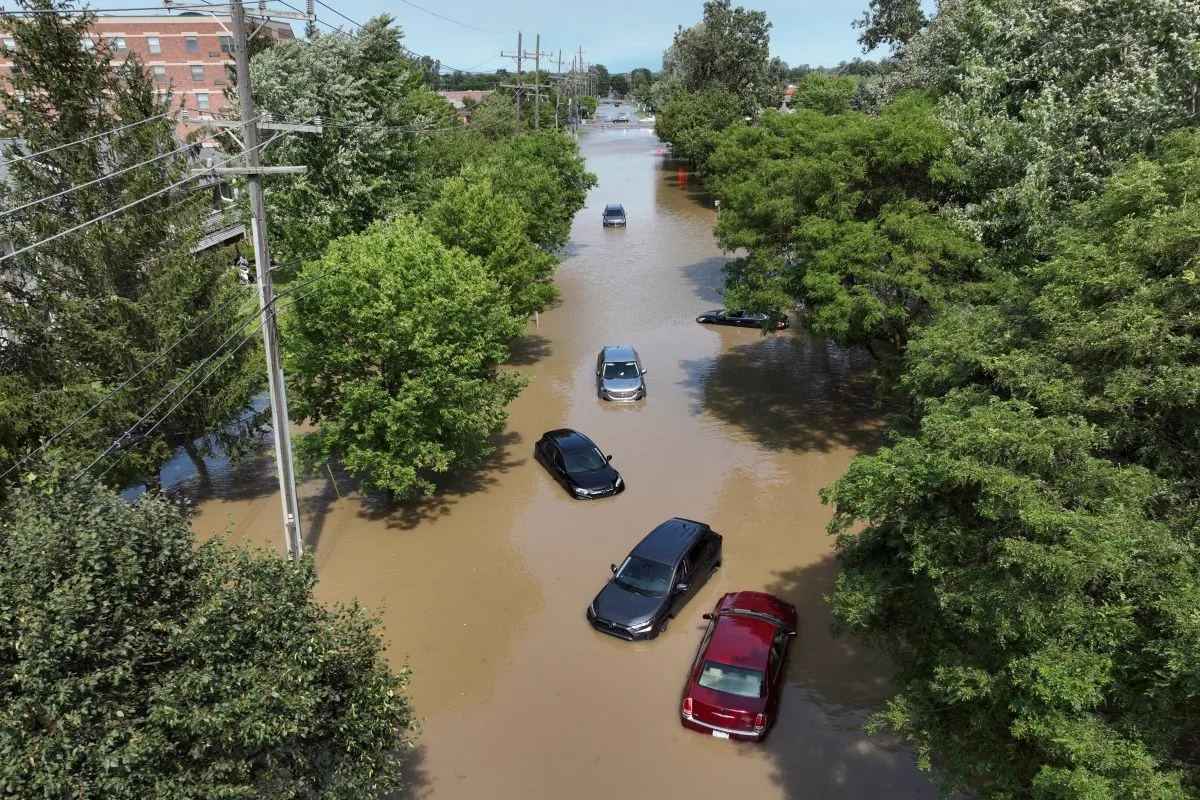 Cars sit stranded in floodwaters on Sheldon Road south of Ford road in Canton, Mich., on Aug. 24, 2023. (David Guralnick/Detroit News via AP)