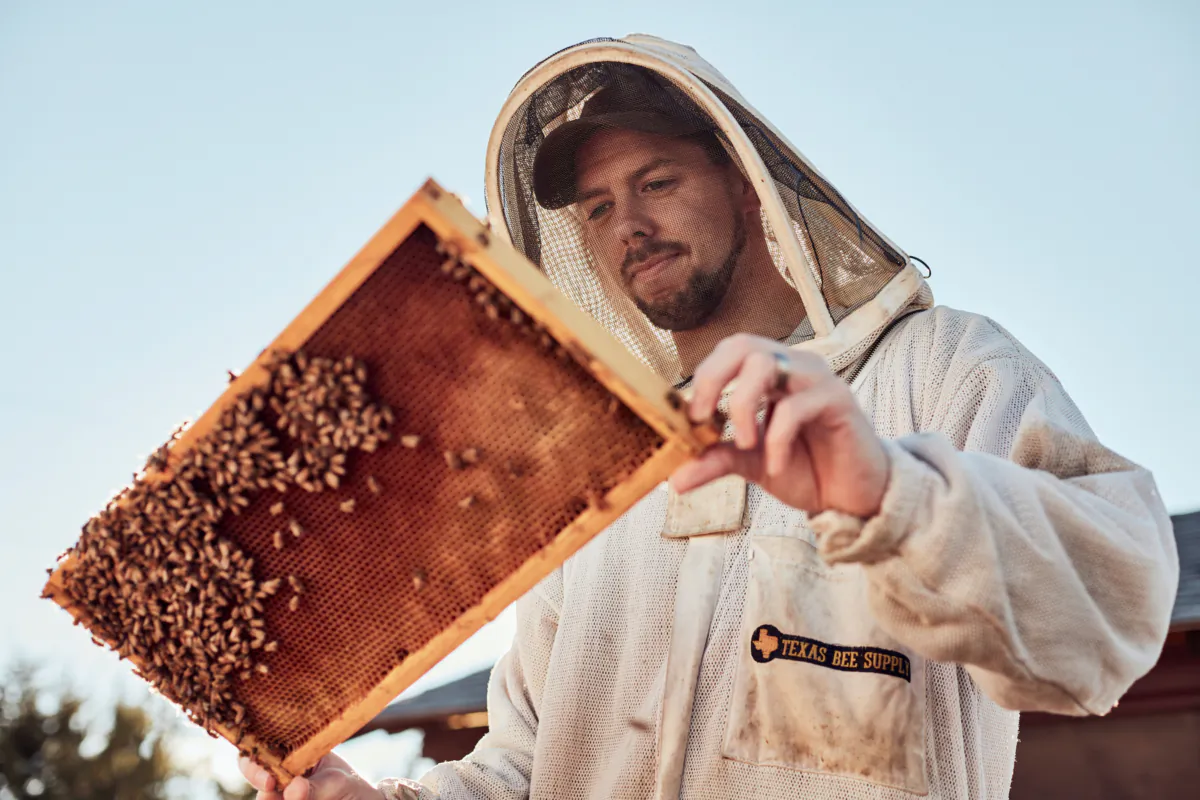 Blake Shook, founder of The Bee Supply, works with his bees. (The Bee Supply)