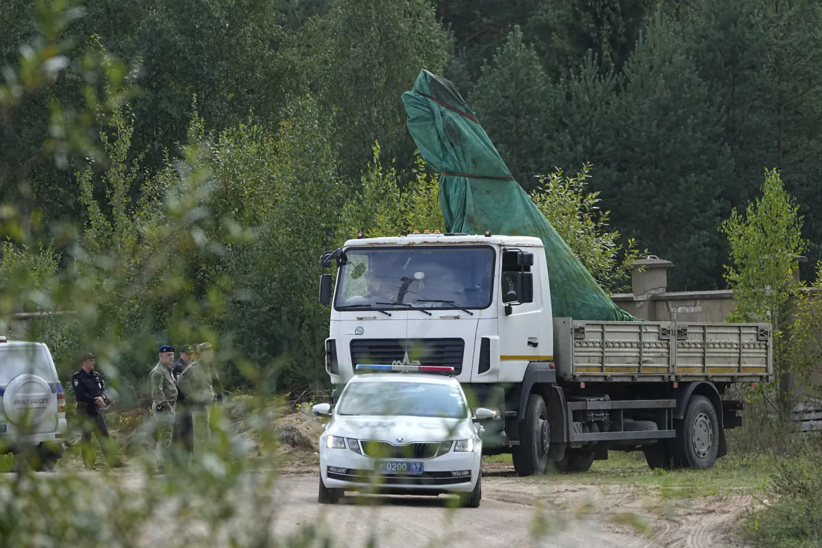 A truck carries a part of a private jet that crashed near the village of Kuzhenkino, Russia, on Aug. 25, 2023. (AP Photo/Alexander Zemlianichenko)