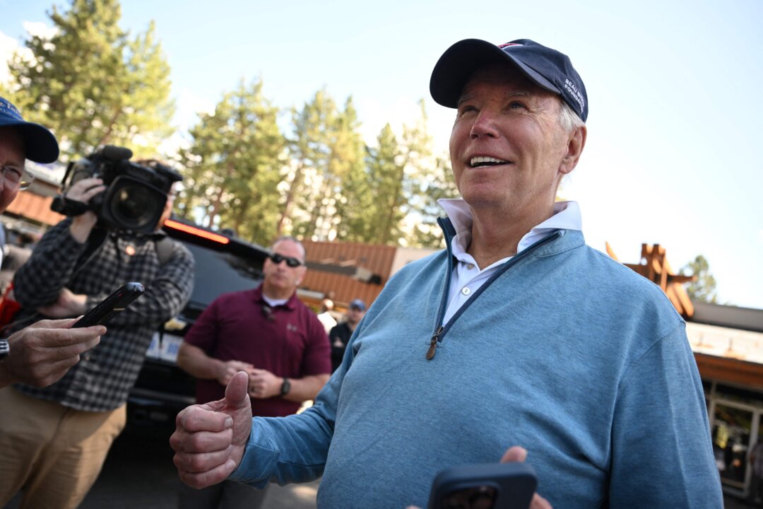 President Joe Biden speaks to the press after attending a Pilates class in South Tahoe, Calif., on Aug. 25, 2023. (Mandel NGAN/AFP via Getty Images)