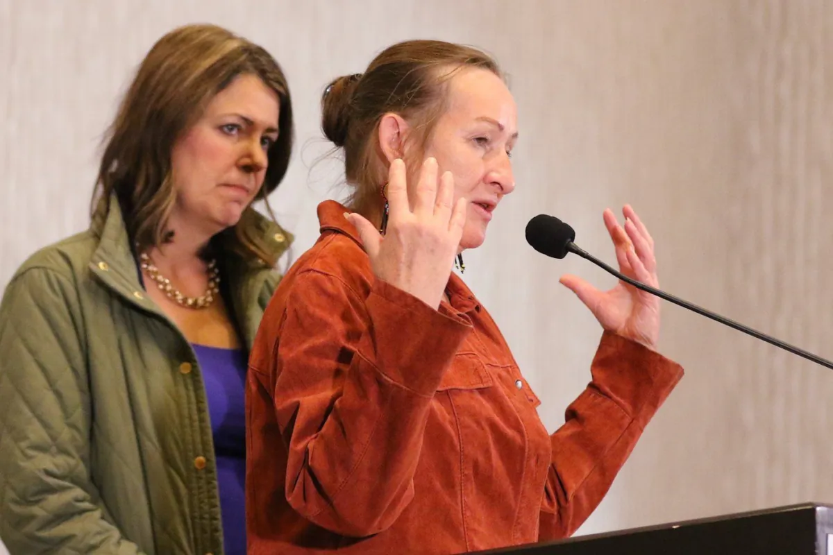 Northwest Territories Premier Caroline Cochrane and Alberta Premier Danielle Smith answer media questions at the City of Calgary’s reception centre for Yellowknife residents who were evacuated due to wildfires, on Aug. 25, 2023. (The Canadian Press/Dave Chidley)