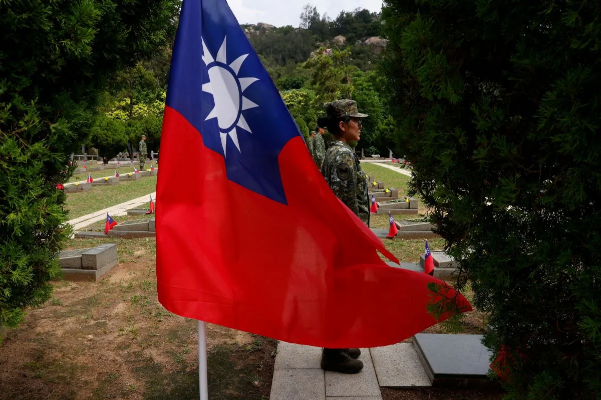 Soldiers stand guard at the grave sites of the fallen soldiers for a ceremony commemorating the 65th anniversary of the Second Taiwan Strait Crisis, in Kinmen, Taiwan, on Aug. 23, 2023. (Ann Wang/Reuters)