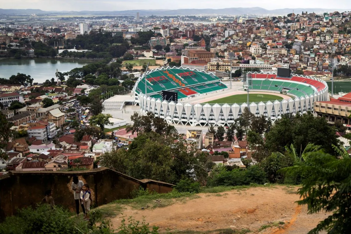 Children stand on a hill as the Mahamasina Municipal Stadium is seen in the background in Antananarivo, Madagascar, on Feb. 3, 2022. (Alkis Konstantinidis/Reuters)