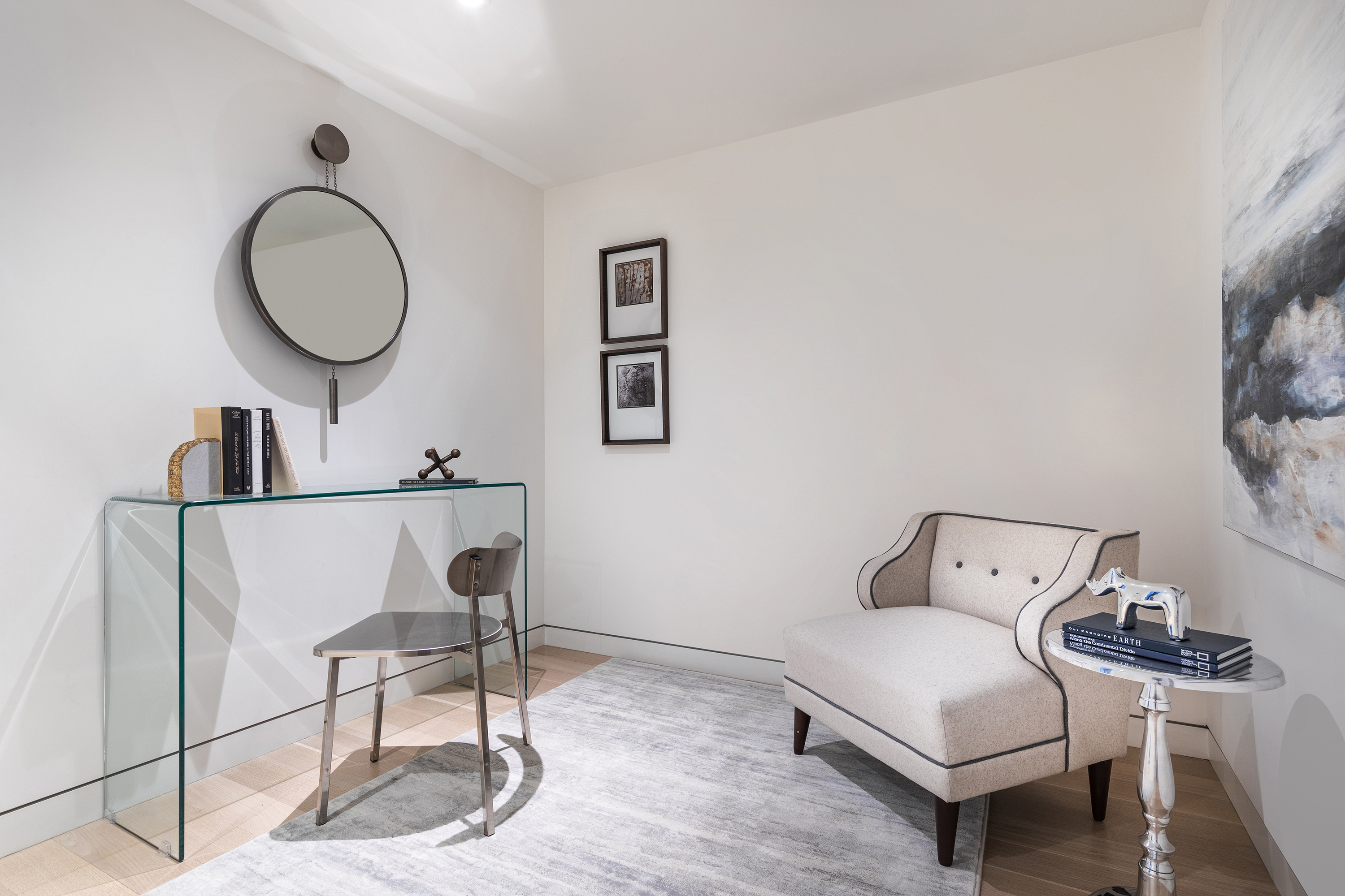 A windowless space is made functional as a small home office and reading area.