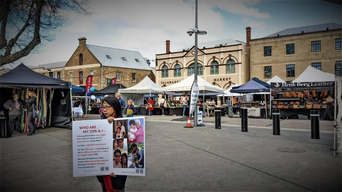Camille Kwan is doing a protest in Hobart, Tasmania on Aug. 26, 2023 to call for attention for her son's situation. (Jenny Nhung/The Epoch Times)