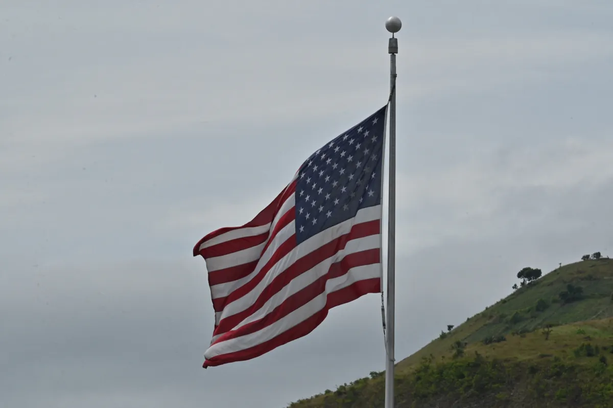 A U.S. flag at a U.S. Embassy building in a file photo. (Adek Berry/AFP via Getty Images)
