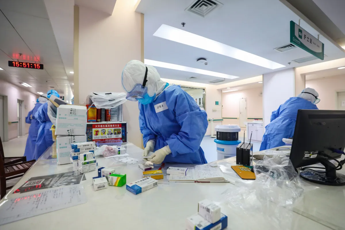 Medical staff prepare medicine for pregnant women infected with COVID-19, at a gynecology and obstetrics isolation ward in Wuhan Union Hospital in Wuhan in China's central Hubei Province, on March 7, 2020. (STR/AFP via Getty Images)