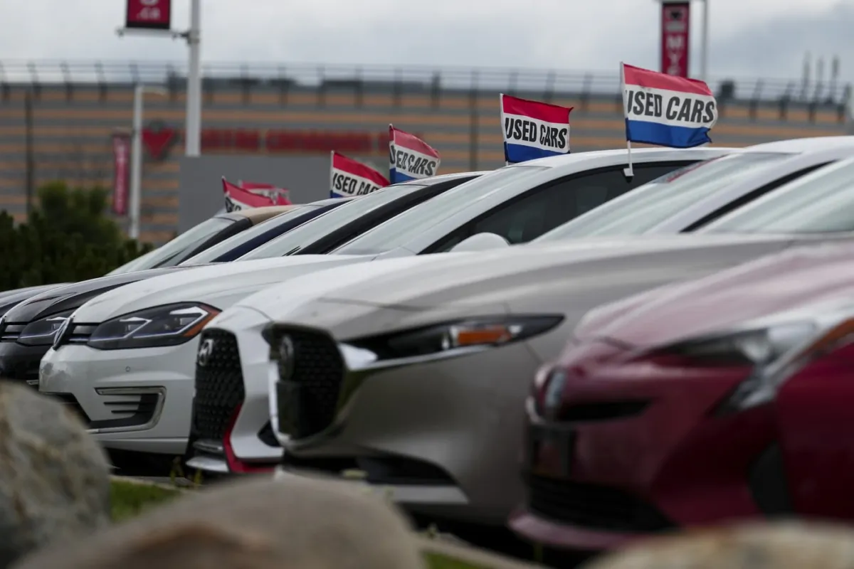Used vehicles for sale are displayed at an automotive dealership in Ottawa on Aug. 11, 2023. (The Canadian Press/Sean Kilpatrick)