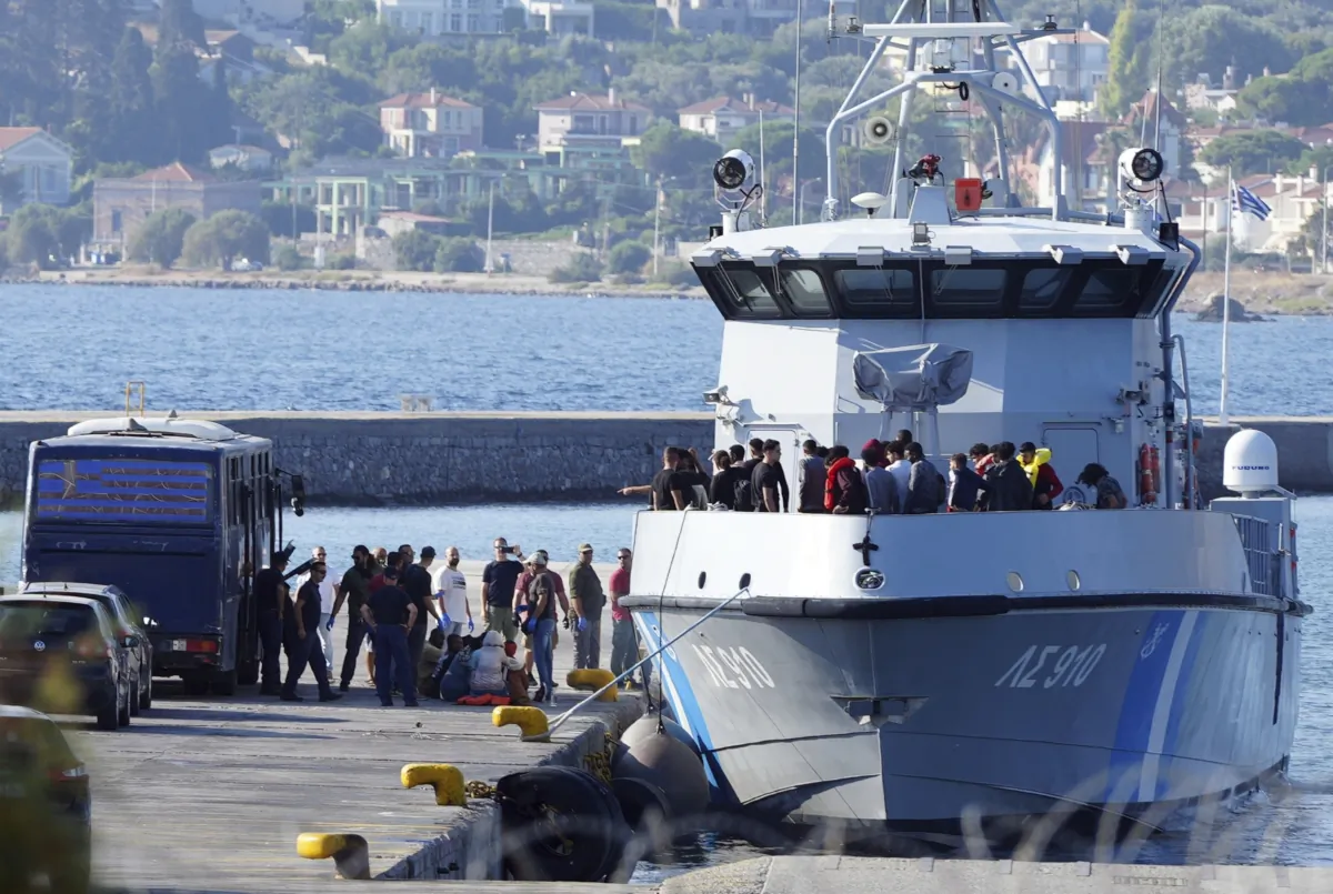 Migrants disembark from a Greek coast vessel after a rescue operation, at the port of Mytilene, on the northeastern Aegean Sea island of Lesbos, Greece, on Aug. 28, 2023. (Panagiotis Balaskas/AP Photo)