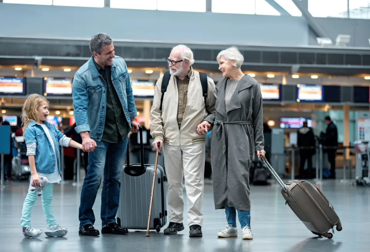 A family vacation is the perfect time to practice and model consideration for others, like helping and being friendly and polite with staff and other travellers.  (Olena Yakobchuk/Shutterstock)