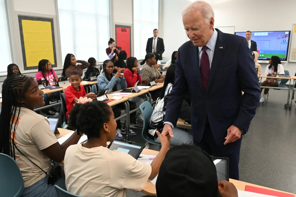 President Joe Biden speaks with students as he and First Lady Jill Biden welcome students back to school while visiting Eliot-Hine Middle School in Washington, on Aug. 28, 2023. (Saul Loeb/AFP via Getty Images)