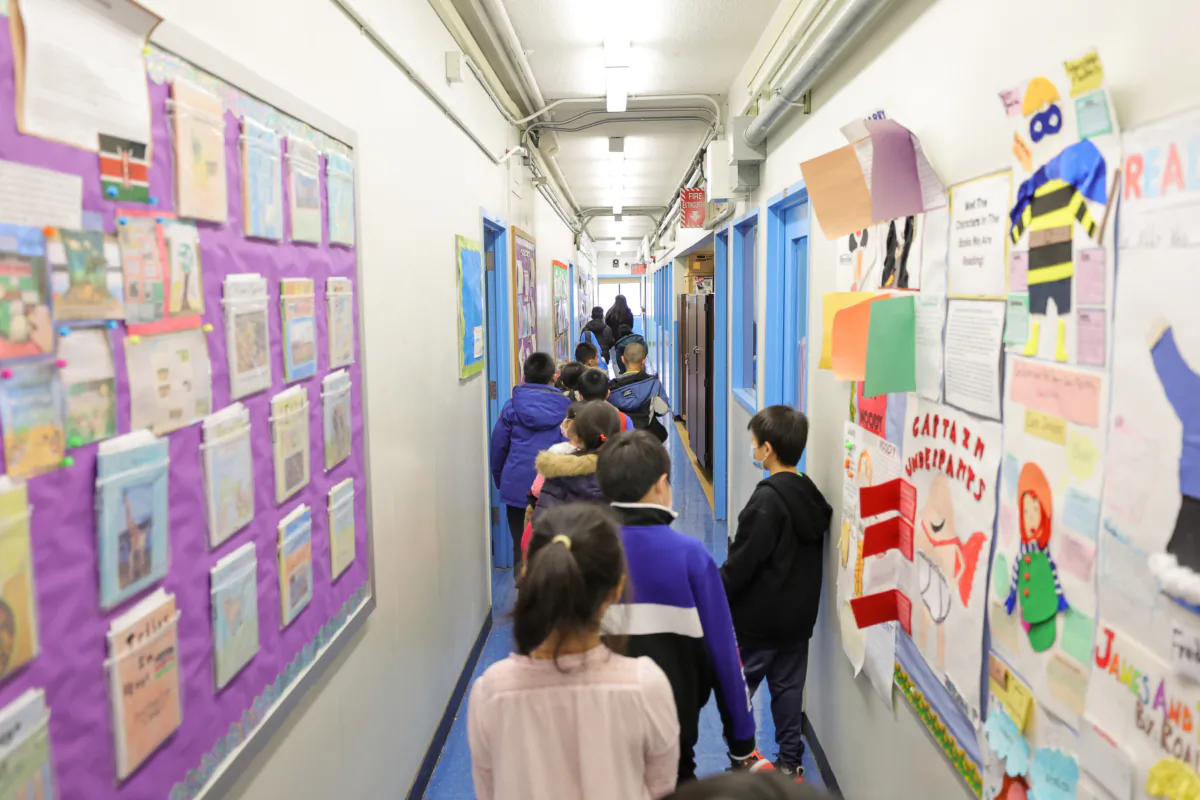 Students walk to class at Yung Wing School P.S. 124 in New York on March 7, 2022. (Michael Loccisano/Getty Images)