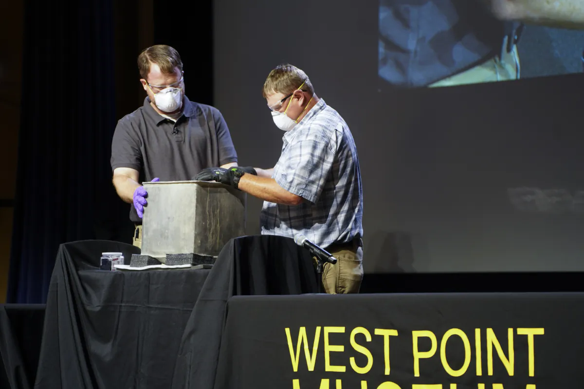 West Point archeologist Paul Hudson (L) and Kevin Hultslander from the West Point Garrison Department of Public Works opened a 200-year-old time capsule at the U.S. Military Academy in West Point, N.Y., on Aug. 28, 2023. (Cara Ding/The Epoch Times)