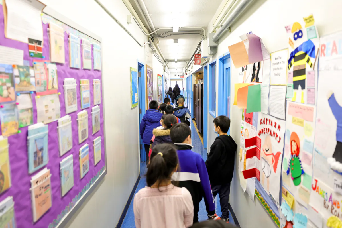 Students walk to class at Yung Wing School P.S. 124 in New York, on March 7, 2022. (Michael Loccisano/Getty Images)
